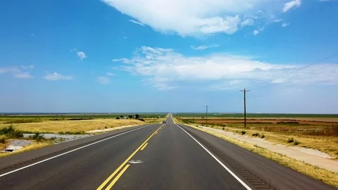 Drive straight ahead TX old highway car drives by Stock Footage 114990940