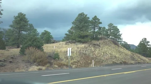 Drive through diverse terrain with changing weather in slow motion 120fps Video stock 280162017