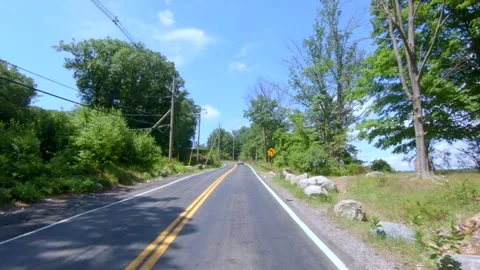 Drive through local roads with blue sky Stock Footage 135670668