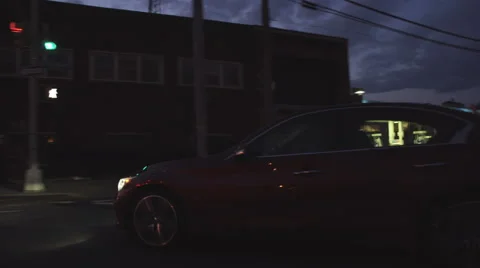 A drive through Queens, New York City at sunset as a car pulls away Stock Footage