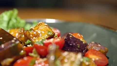 Drive through salad with eggplants, close-up of fried eggplants with greens and Stock Footage 256143470