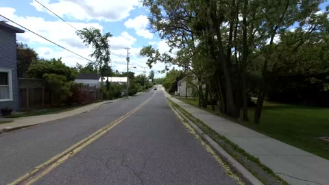 A drive through a small town POV - 4K Stock Footage 132883078