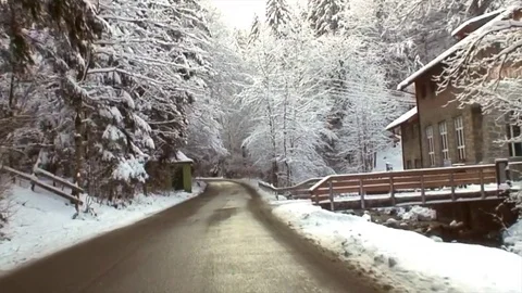 Drive through snowy winding alpine road in high speed I Stock-Footage 83967822