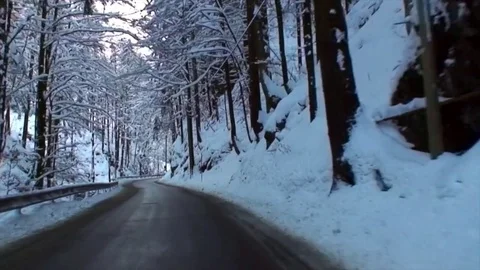 Drive through snowy winding alpine road in high speed V Stock-Footage 84048320