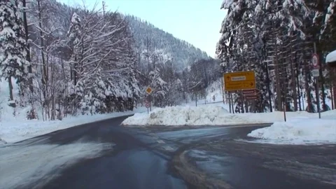 Drive through snowy winding alpine road in high speed VIII Stockbeeldmateriaal 84049045