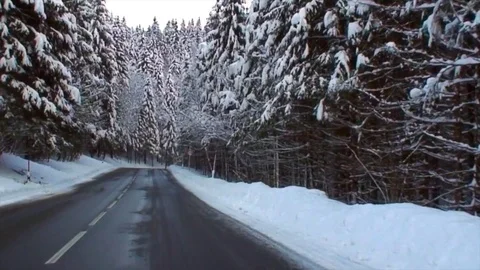 Drive through snowy winding alpine road in high speed VII Stockbeeldmateriaal 84049076