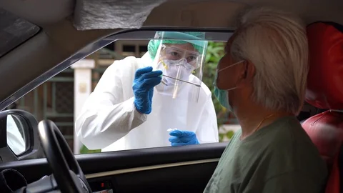 Drive thru COVID-19 Test, Nasal swab Stock Footage 129654184