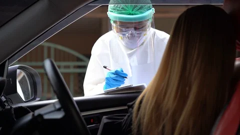Drive thru COVID-19 Test, Nasal swab Stock Footage 129654189