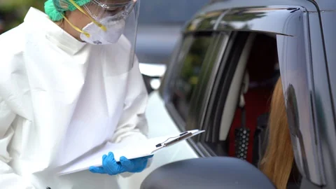 Drive thru COVID-19 Test, Nasal swab Stock Footage 129654195