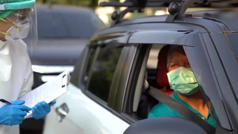Drive thru COVID-19 Test, Nasal swab Stock Footage 129654196