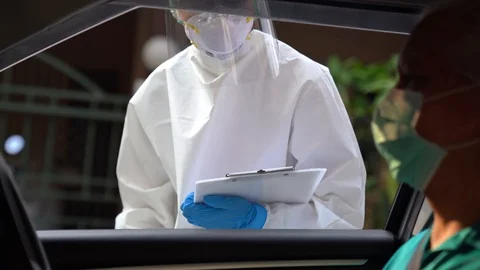 Drive thru COVID-19 Test, Nasal swab Stock Footage 129654197