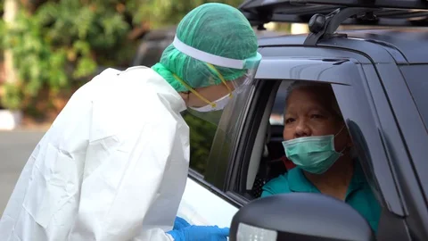 Drive thru COVID-19 Test, Nasal swab Stock Footage 129654215