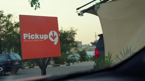 Drive thru pickup orders sign from inside car Stock Footage 336643610
