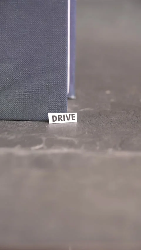Drive Word on Paper Label Representing Motivation, Ambition and Personal Success Stock Footage 338238286