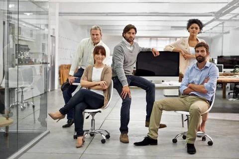 Driven young pros. Portrait of a group of dedicated and dynamic design Stock Photos