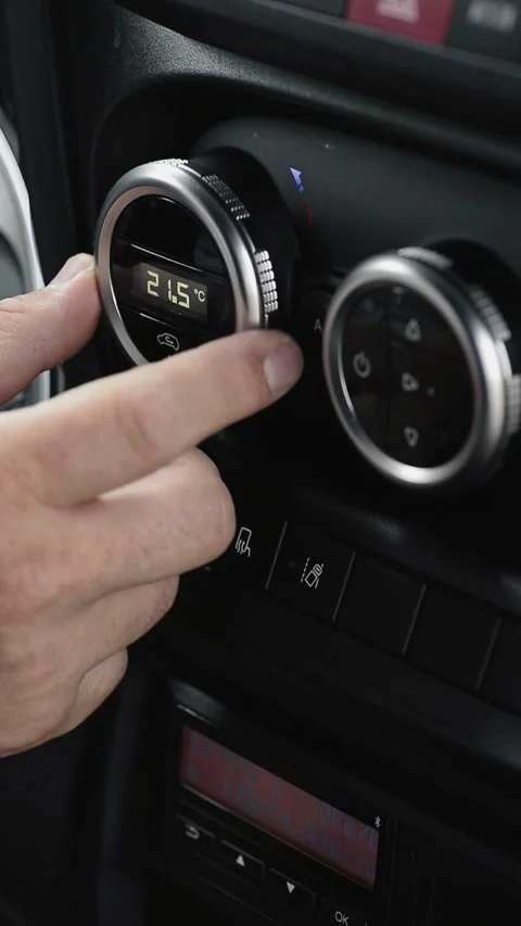 Driver adjusting climate control temperature in truck vertical Stock Footage 340078176