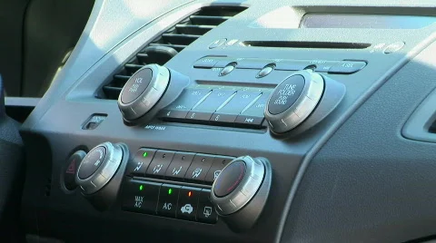 Driver adjusting controls of car 库存影片 828300