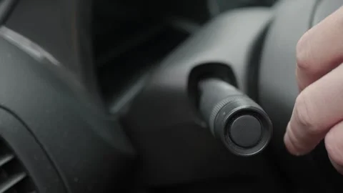 Driver adjusting dashboard knob closeup Stockbeeldmateriaal 336445109