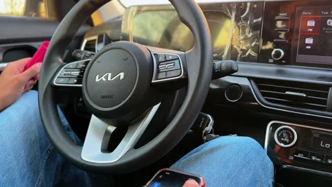 Driver Adjusting Kia Car Infotainment Touch Screen Stock Footage 344548592