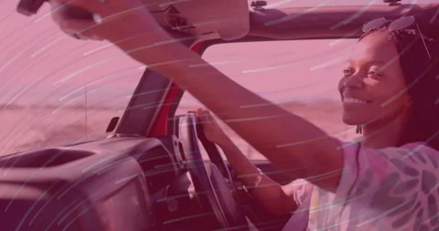 Driver adjusting mirror initiating graphic swirl overlay showing automotive Stock Footage 314845226