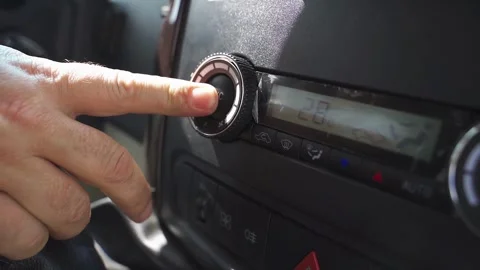 Driver adjusts minibus heating and cooling system for passenger comfort 動画素材 295034647