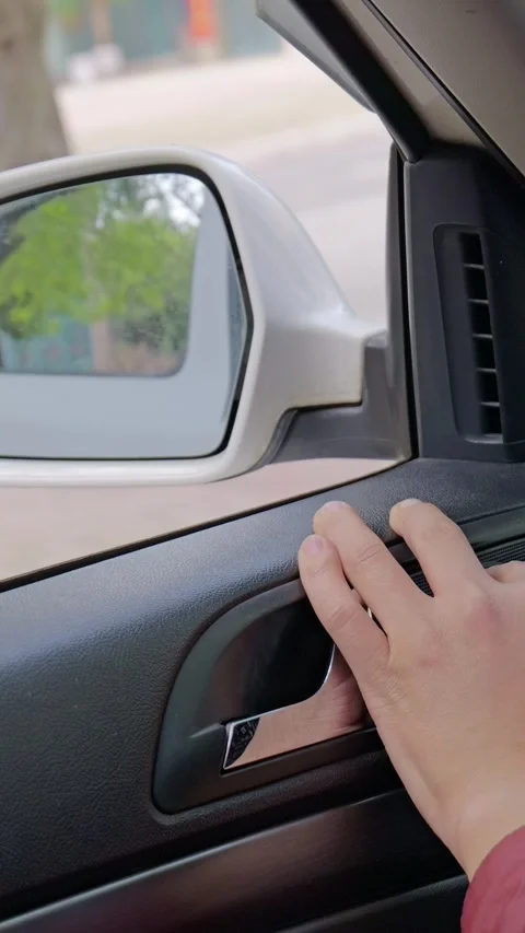 The driver adjusts the rearview mirror. Stock Footage 329369962