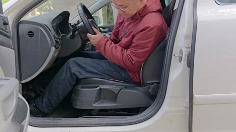 The driver adjusts the seat forward and backward. Stock Footage 329166011
