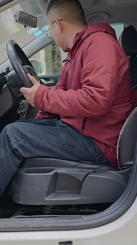 The driver adjusts the seat forward and backward. Stock Footage 329397837