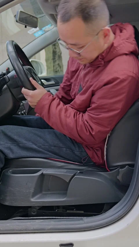 The driver adjusts the seat forward and backward. Stock Footage 329397845