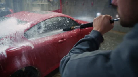 Driver Applying Detergent with Foam Gun at Car Wash Video stock 325071198