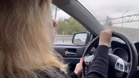 Driver behind the wheel, a close-up of a person driving, a safe distance fr.. Stock Footage 252020857