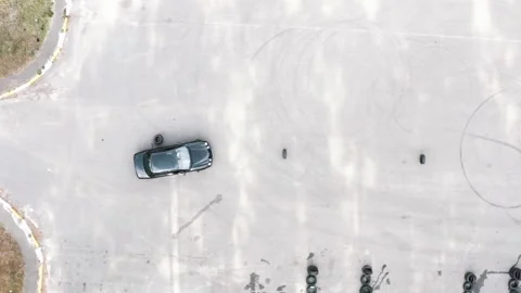 Driver on black car flunked exams by hitting tires. bad driver Stock-Footage 144822550
