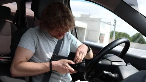 Driver cannot afford another car repair and checks his nearly empty wallet Stock Footage 343719666