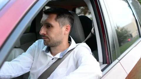 Driver of a car being bored sitting in his vehicle waiting. Stock Footage 93755754