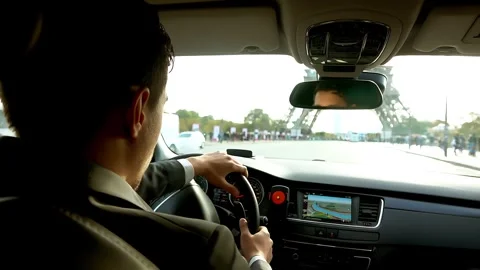 Driver in the car moves to the Eiffel Tower in Paris Stock Footage 263034559