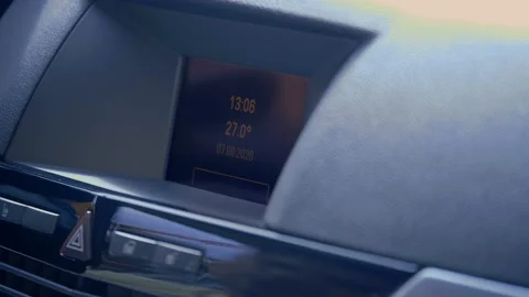 The driver in the car presses the radio button and turns up the volume Stock Footage 138280968