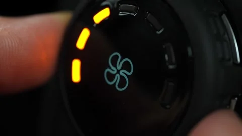 Driver changing the air flow in the vehicle by manipulating climate control.. Stock Footage 293844724