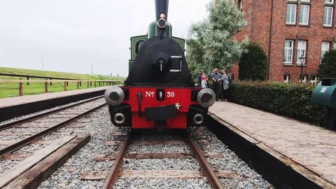 The driver of the classic train gets out. Video stock 116185950