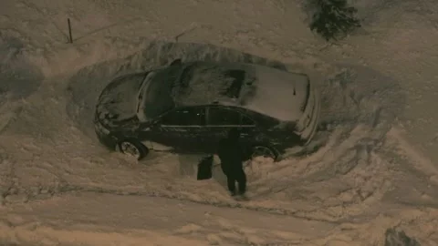 Driver clearing snow-covered road Stock Footage 287600780