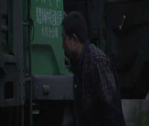 Driver climbs into cab of coal truck Video stock 86744876