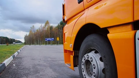 Driver climbs up the stair of the cargo TIR transportation truck Stock Footage 83417364
