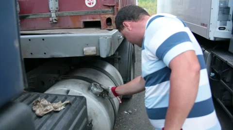 The driver closes the fuel tank Stock Footage 32861905