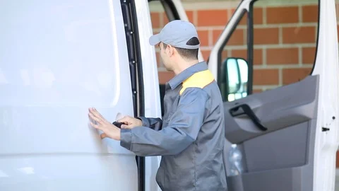 Driver closing van door Stock Footage 96016365