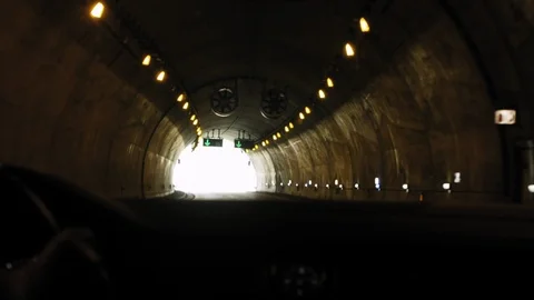 Driver Coming Out of a Tunnel, frame turns full of light to be white Stock Footage 91293696