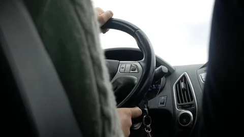 The driver controls the car in a car Stock Footage 85444109