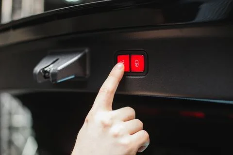 Driver controls the settings of his car with buttons Stock Photos