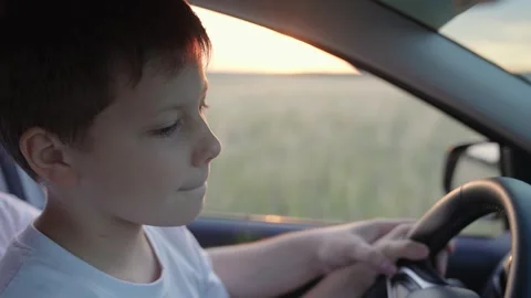 Driver dad child son driving car. Happy family, childhood. Driving car kid. Dad Stock Footage 314345005