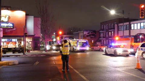 Driver dangerously breaks quickly while cop directing traffic tells him to stop Stock Footage 104227098
