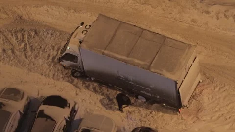 A driver digs his car out of the snow Stock Footage 287600920
