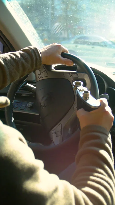 The driver drinks strong alcohol while driving - vertical video. Stock Footage 320357358
